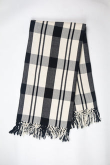 Cecilia black and white cotton throw showing the hand-embroidered randa