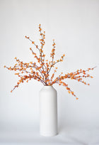 Artificial bittersweet floral stem styled in a vase