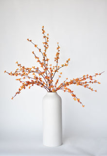Artificial bittersweet floral stem styled in a vase