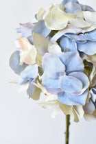 Artificial hydrangea stem with soft pastel-colored flowers