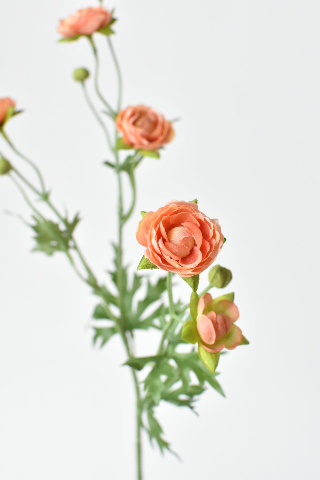 Artificial peach ranunculus stem with delicate blooms