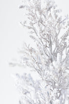 Faux snowy branches with glitter finish for winter home décor
