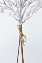 White flocked faux branches for vases and holiday arrangements