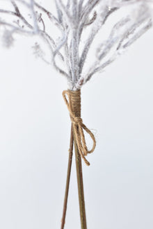 White flocked faux branches for vases and holiday arrangements