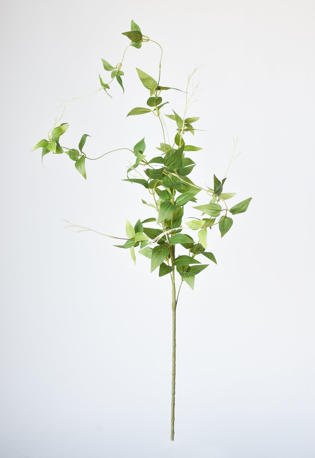 Artificial clematis vine greenery for tall vases