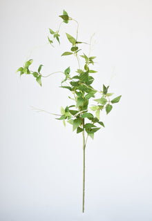 Artificial clematis vine greenery for tall vases
