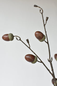 Artificial fall branch with acorns and wired stems