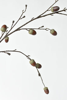 Artificial twiggy branch with realistic acorns
