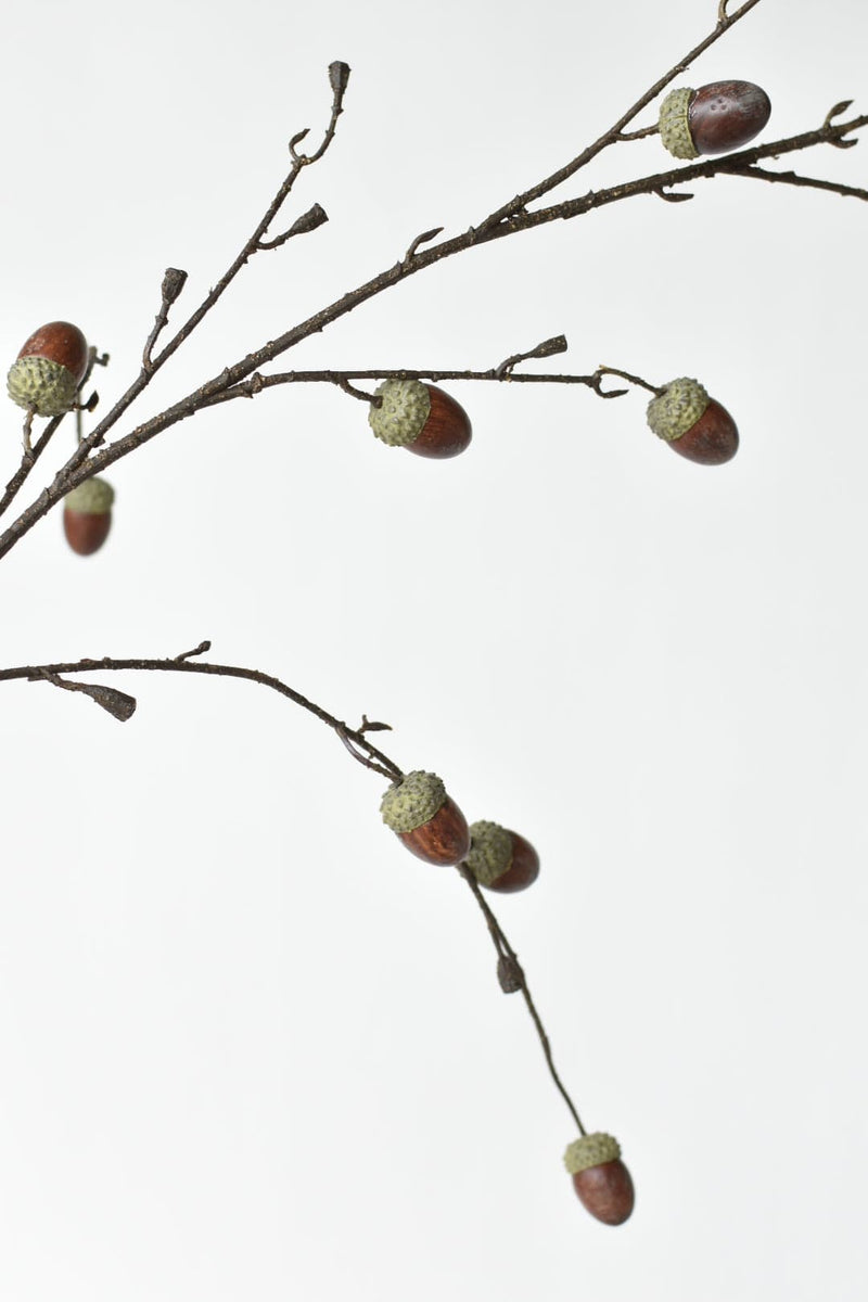 Artificial twiggy branch with realistic acorns