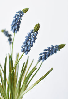 Artificial blue grape hyacinth bush with green leaves