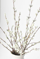 Artificial pussy willow branch styled in vase