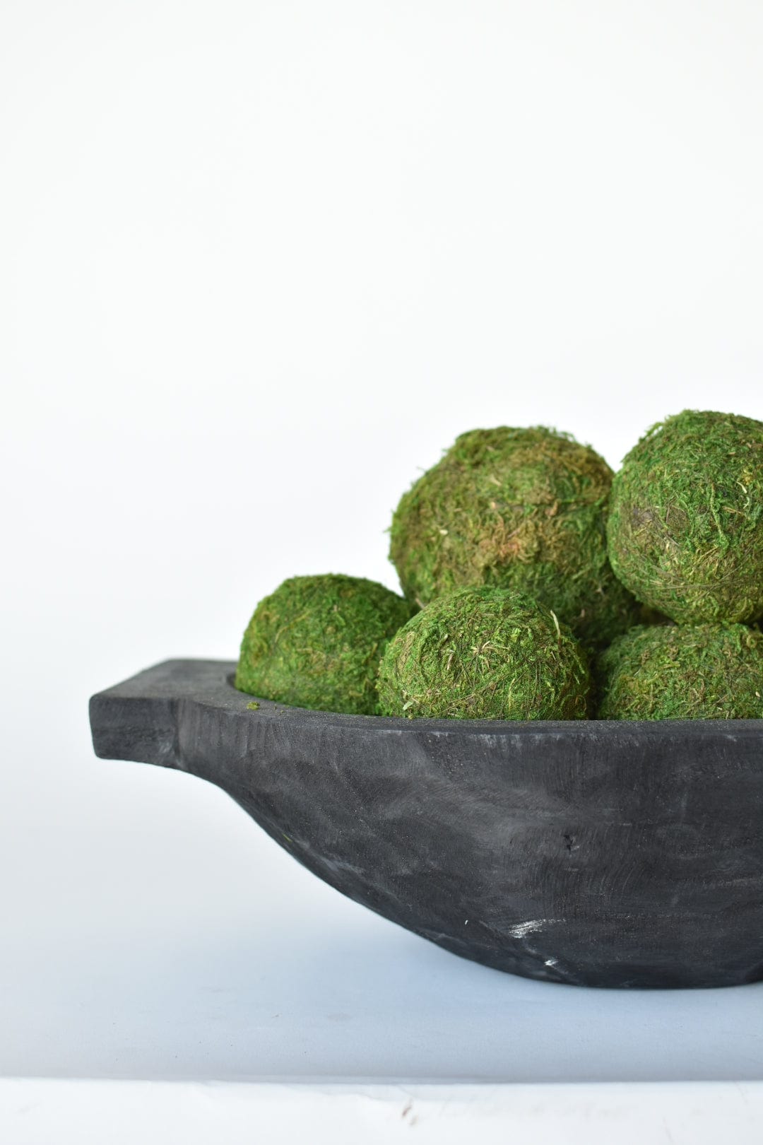 Decorative preserved green moss spheres