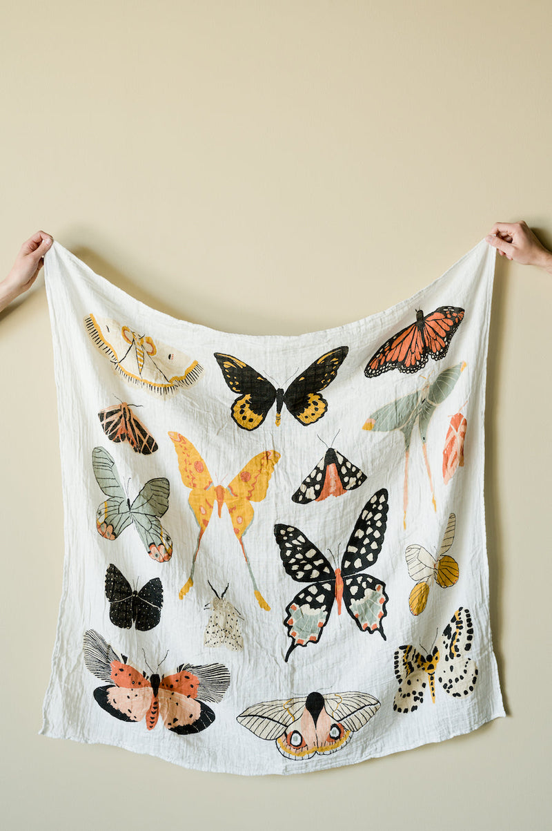 Clementine Kids Butterfly Collector swaddle styled in nursery