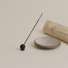 Black and brass incense holder with stable weighted base