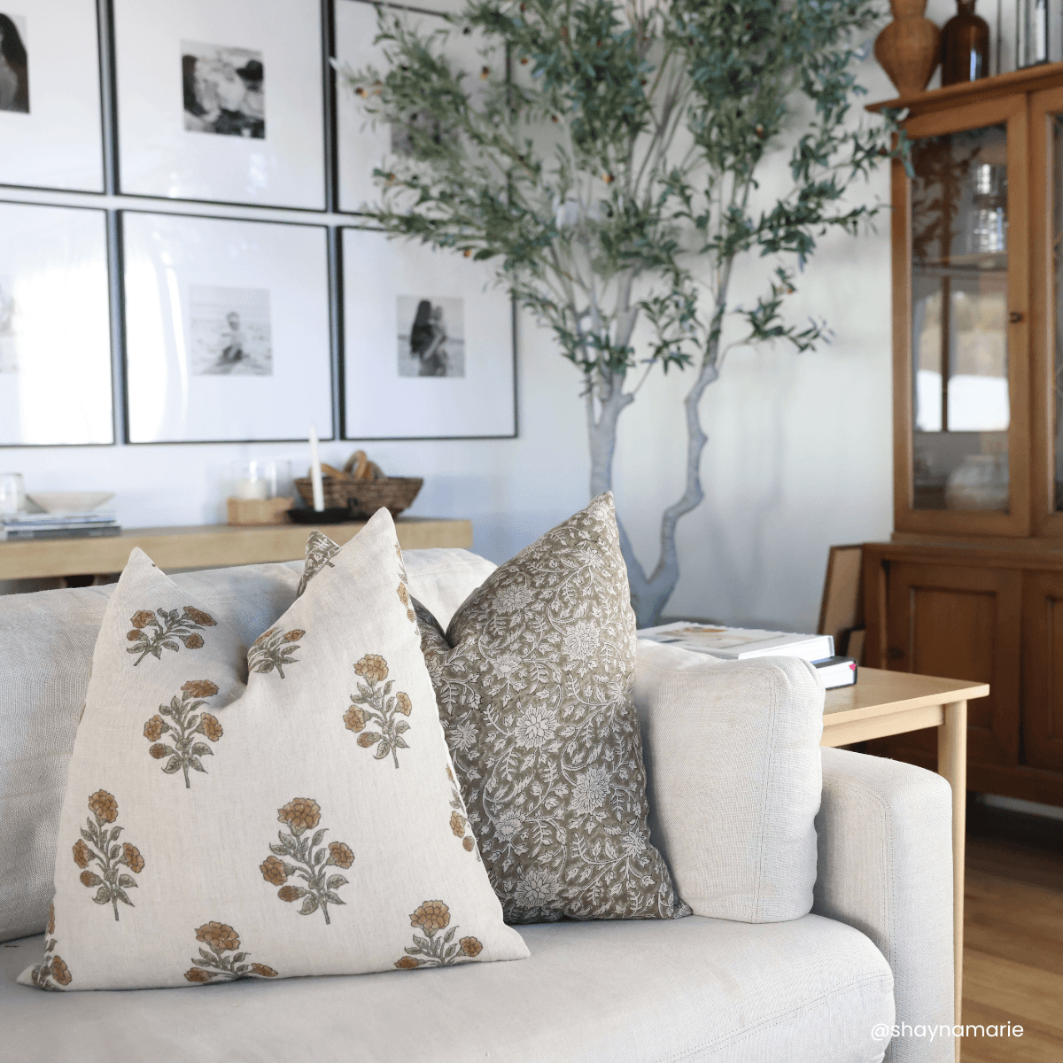 Leila olive green floral pillow styled with coordinating floral pillows