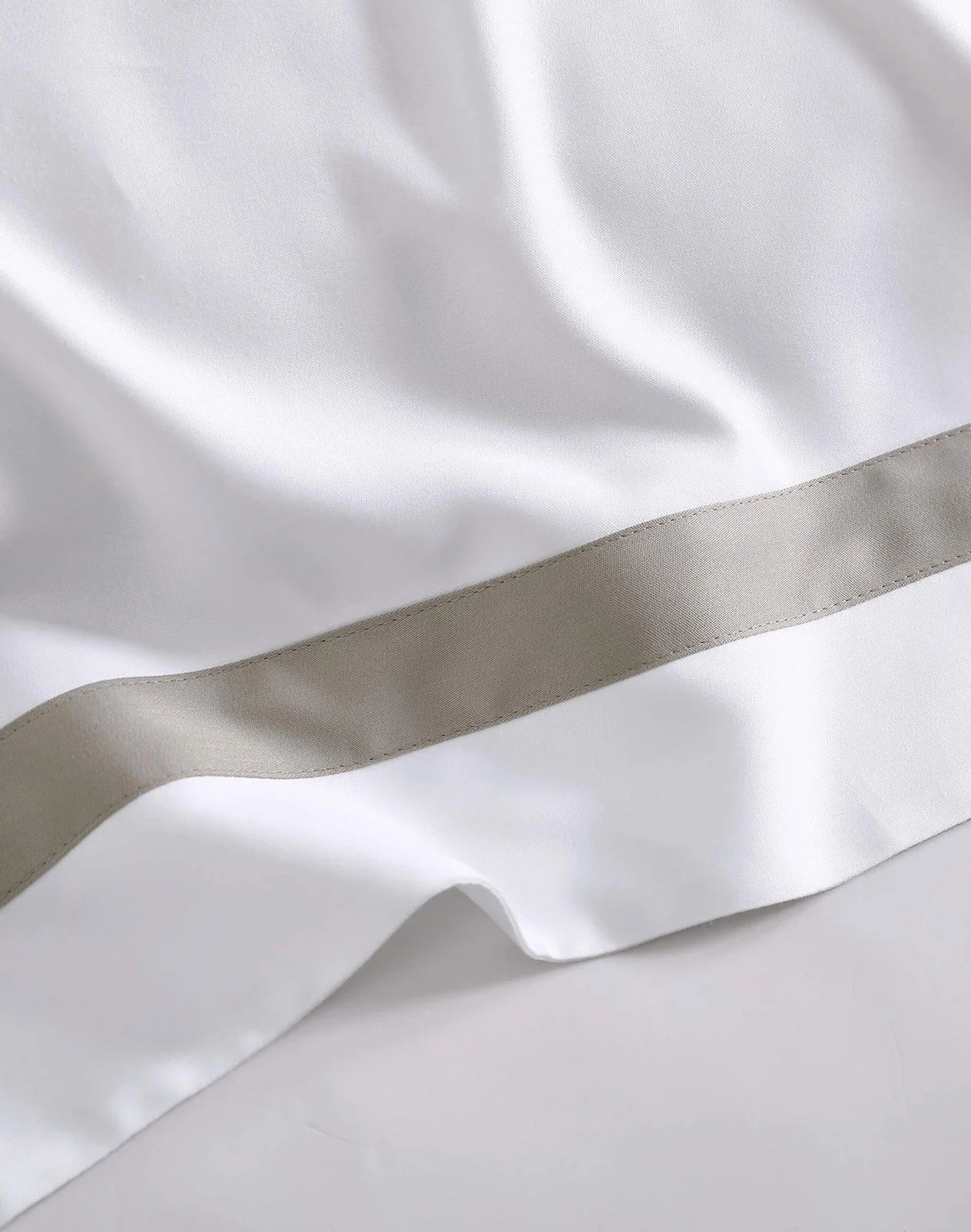 Close-up of bamboo viscose pillowcase with modern tape border