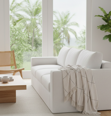 Kiara natural cotton throw styled in a living room