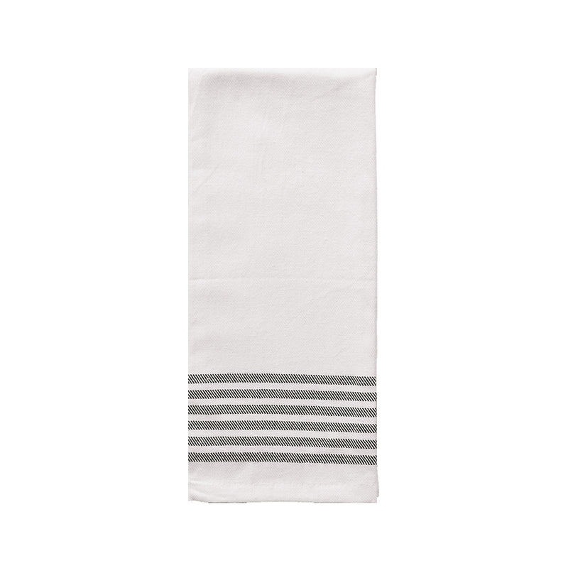 Cream cotton tea towel with six black stripes hanging on hook