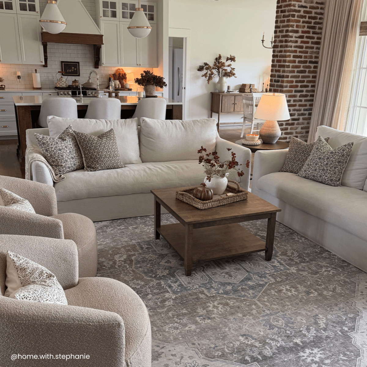 Juliette blue floral pillow in a styled living room