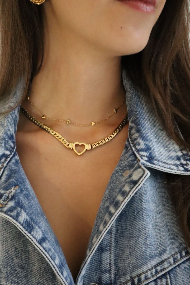 Romantic 18K gold heart necklace styled on model