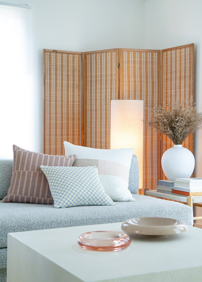 Checkered brocade pillow in grey and white styled in a home interior