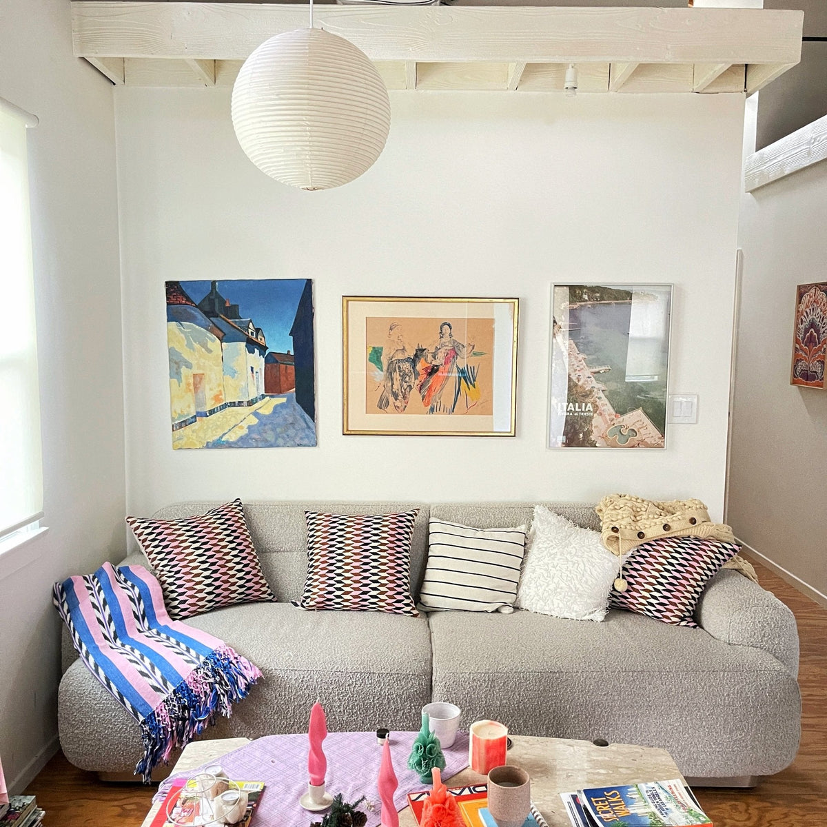 Palm ikat blanket in blue and pink styled in a home interior