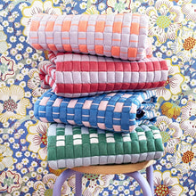 Quilted Sujani throw blanket in soft lilac and red styled in a home interior