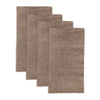 Natural dark beige linen napkins folded on dinner plate
