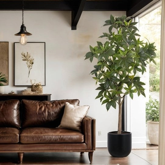Tall faux money tree styled in modern living room