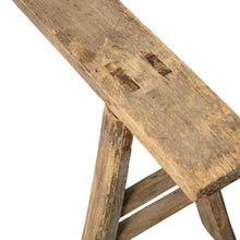 Rustic wooden bench with natural imperfections