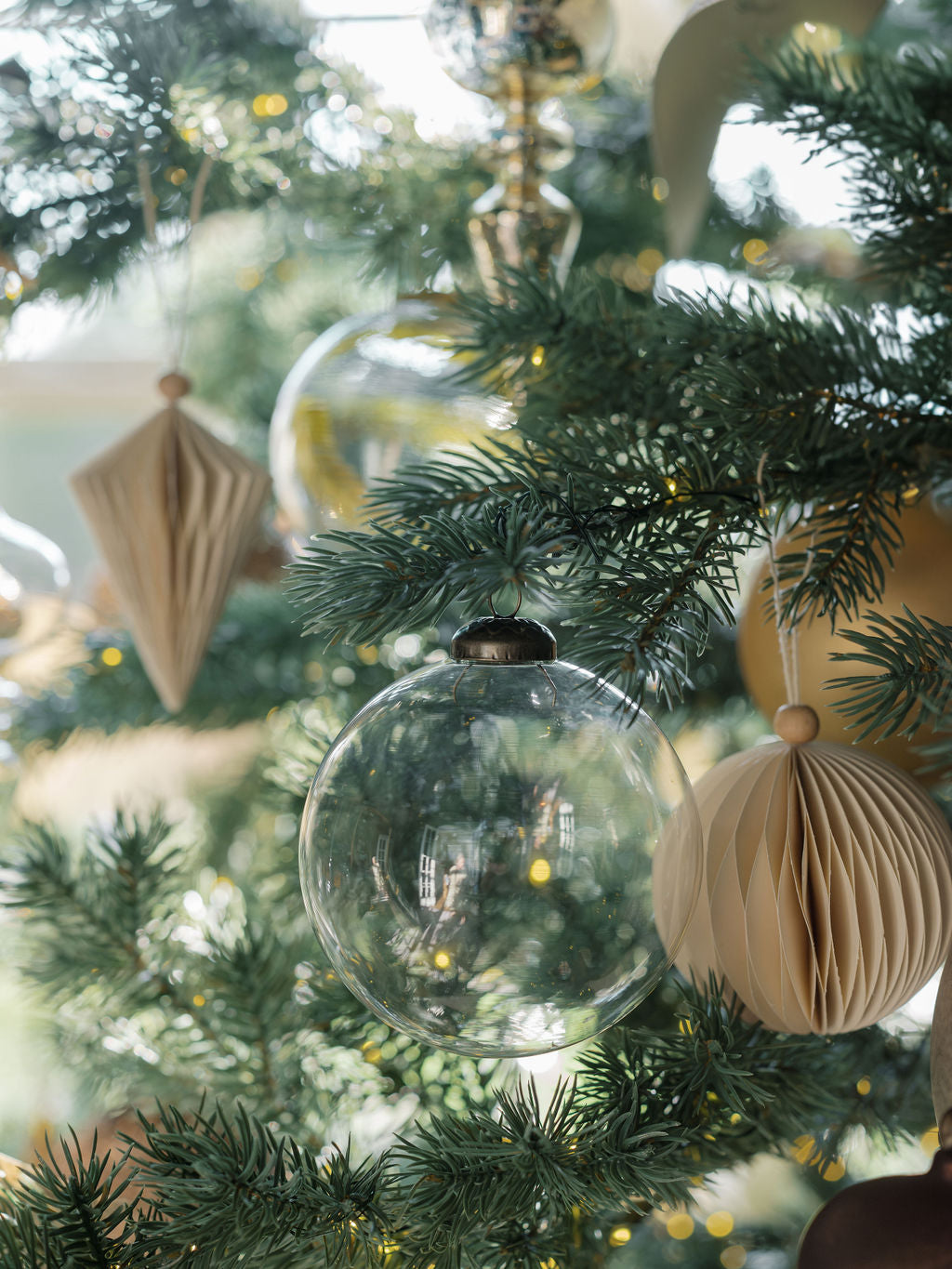 Elegant clear glass ornaments sparkling on holiday tree