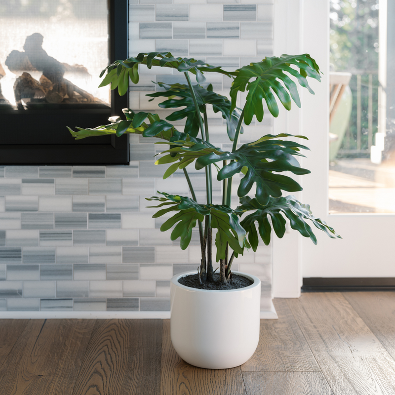 Artificial potted philodendron with vibrant green leaves