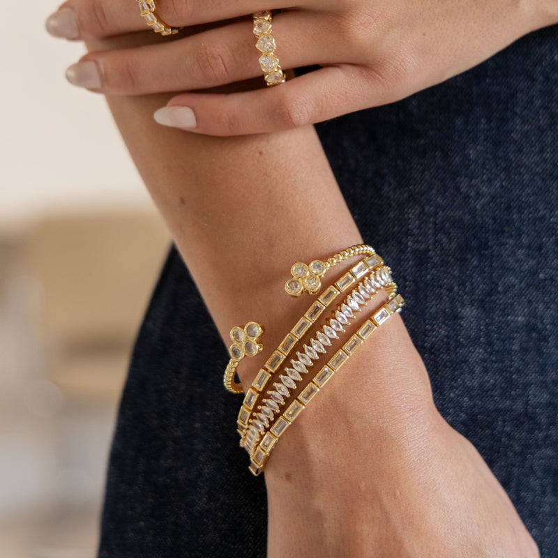 Close-up of sparkling CZ tennis bracelet in gold plating