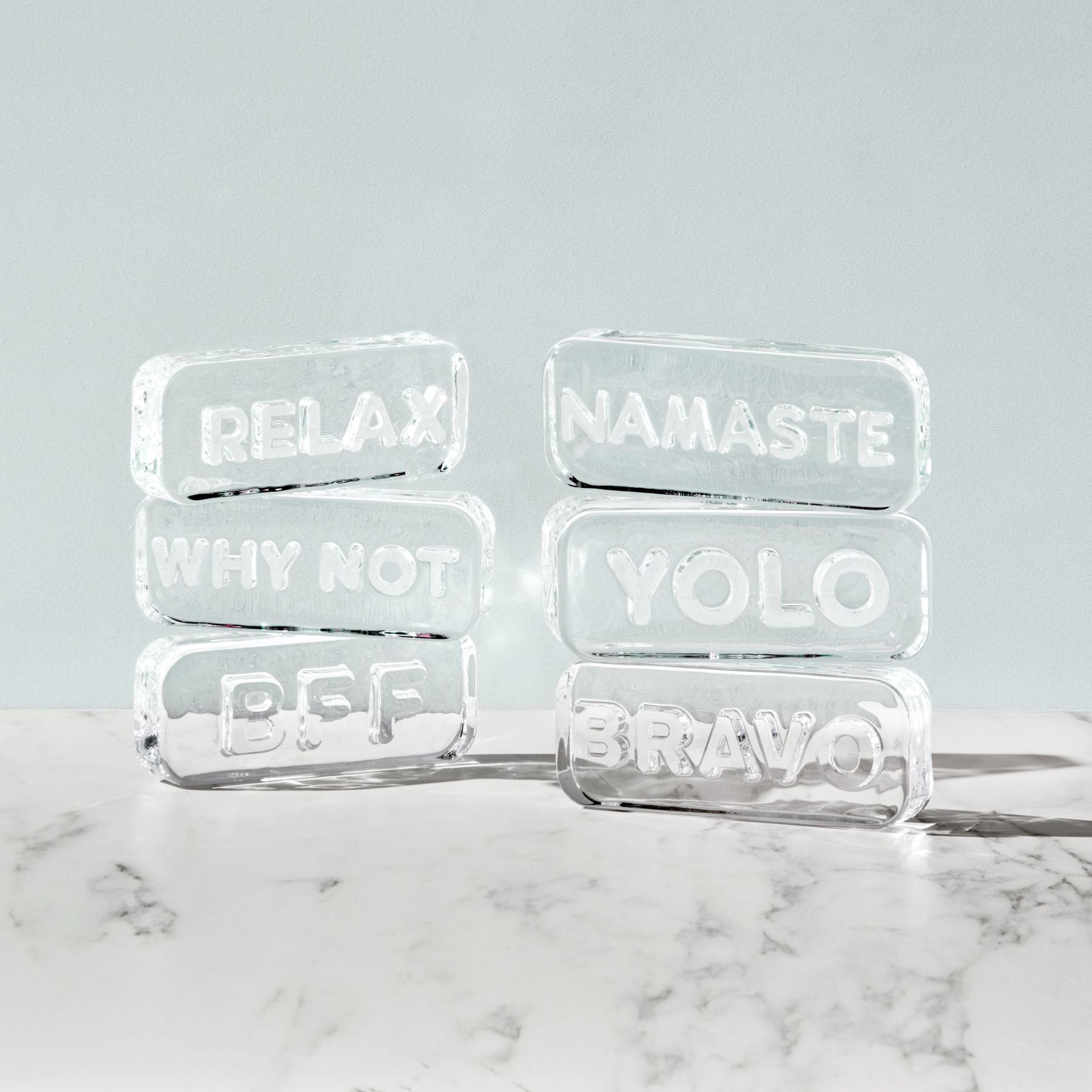 Clear glass paperweight engraved with Namaste message