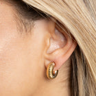 Close-up of 20mm textured gold hoop earrings