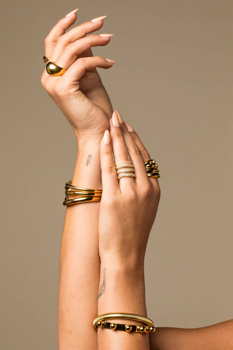 Close-up of gold pave ring sparkling under light