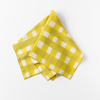 18x18 yellow cross-hatch napkin styled on dining table
