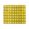 Yellow linen placemat with painterly cross-hatch design