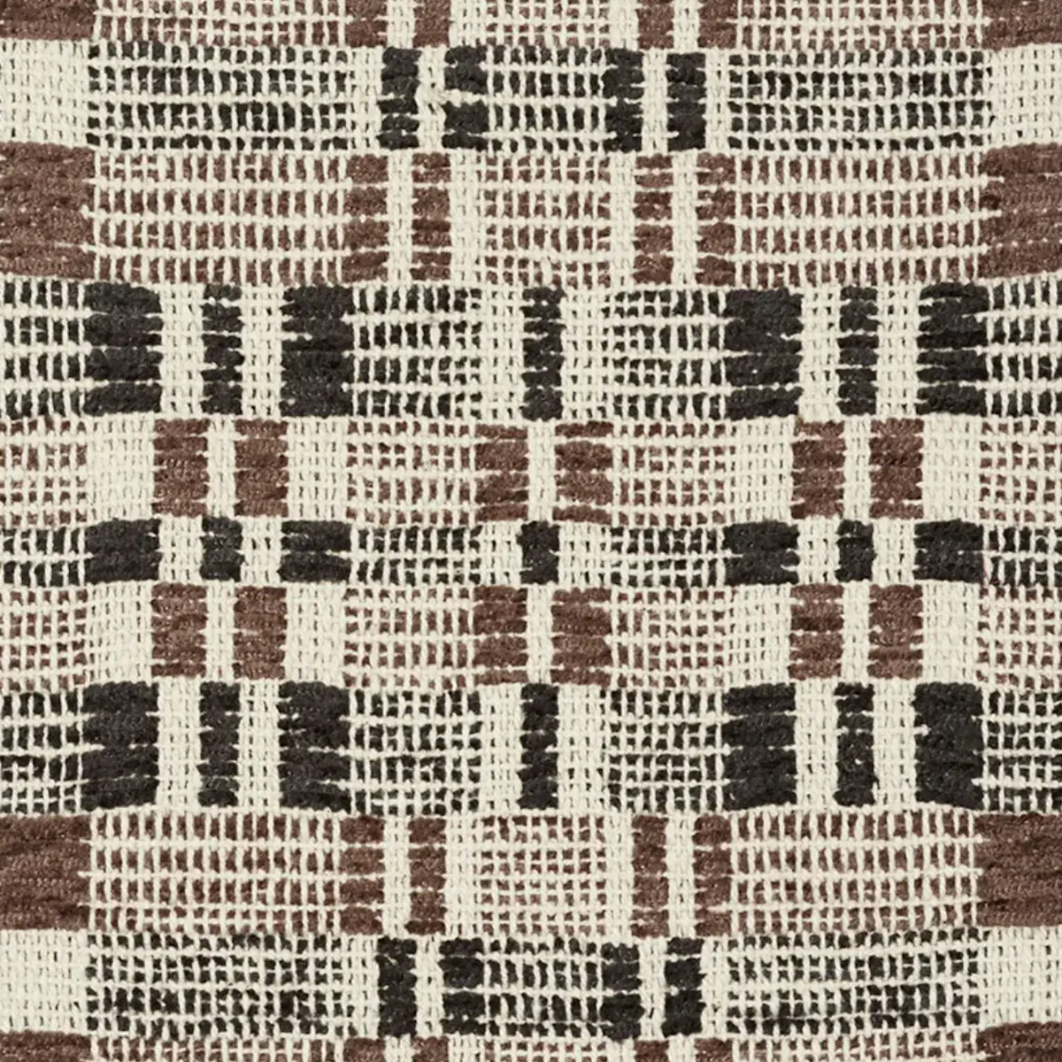 Brimfield Woven Pillow Cover in Cinder shown on a sofa