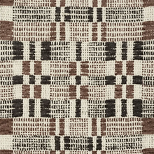 Brimfield Woven Pillow Cover in Cinder shown on a sofa