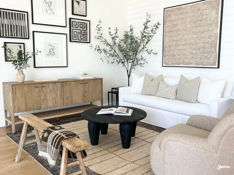 Curated modern living room featuring neutral decorative pillow covers, layered rugs, wall art, and home decor accents by One Affirmation