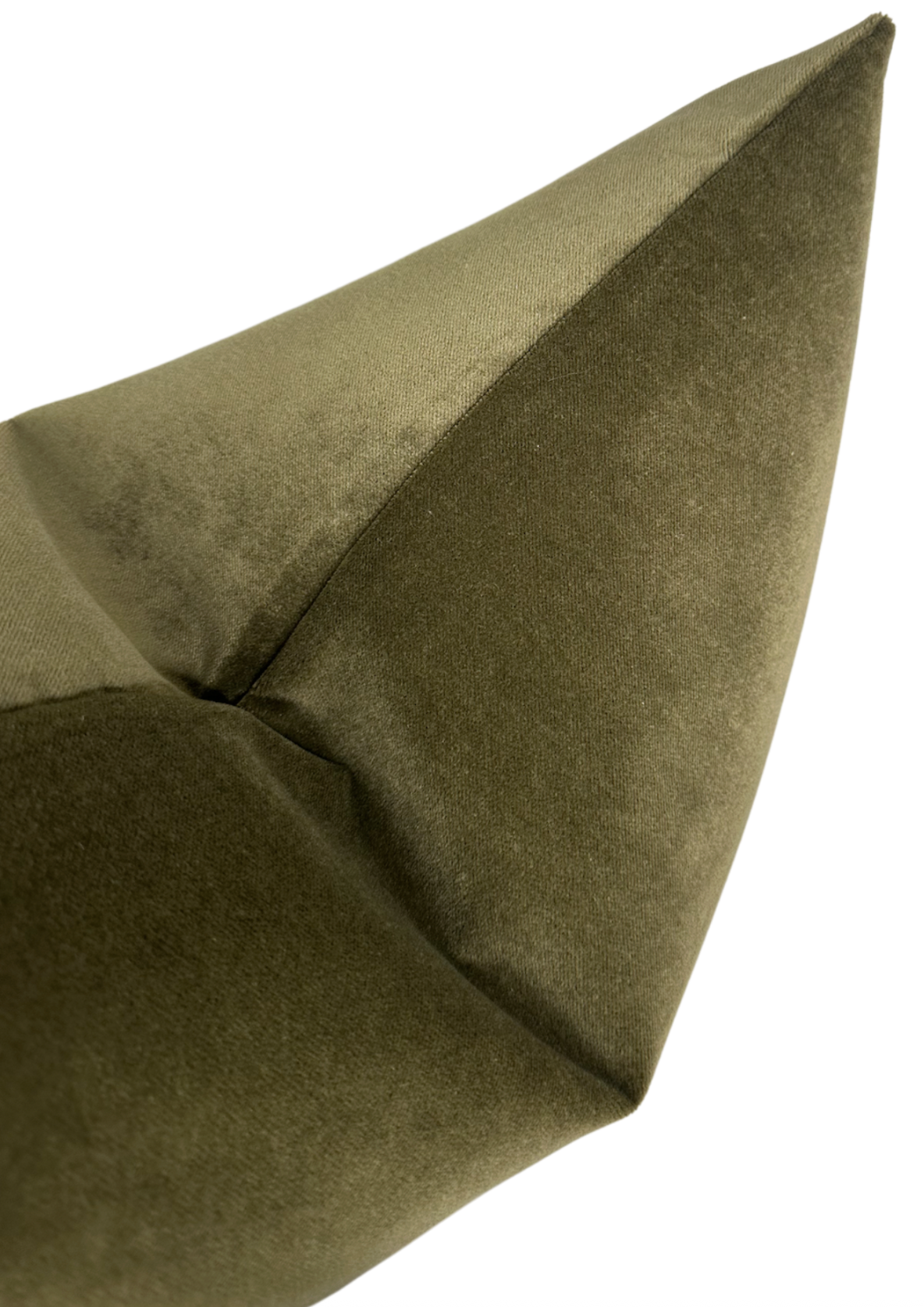 Olive velvet pillow cover styled on a sofa