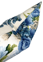 Hidcote blue floral lumbar pillow styled with coordinating pillows
