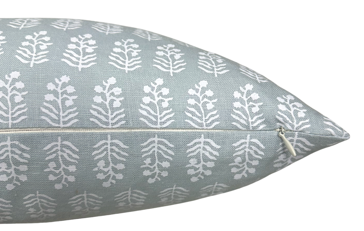Chloe spa blue pillow cover styled with coordinating pillows