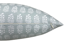 Chloe spa blue pillow cover styled with coordinating pillows