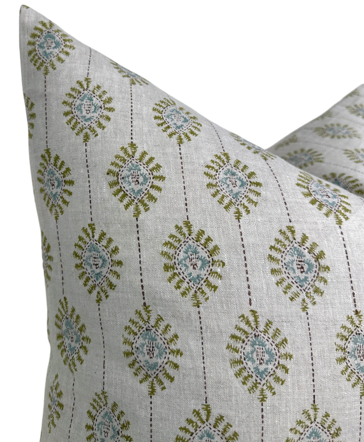 Bombay moss green pillow cover styled in a room