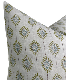 Bombay moss green pillow cover styled in a room