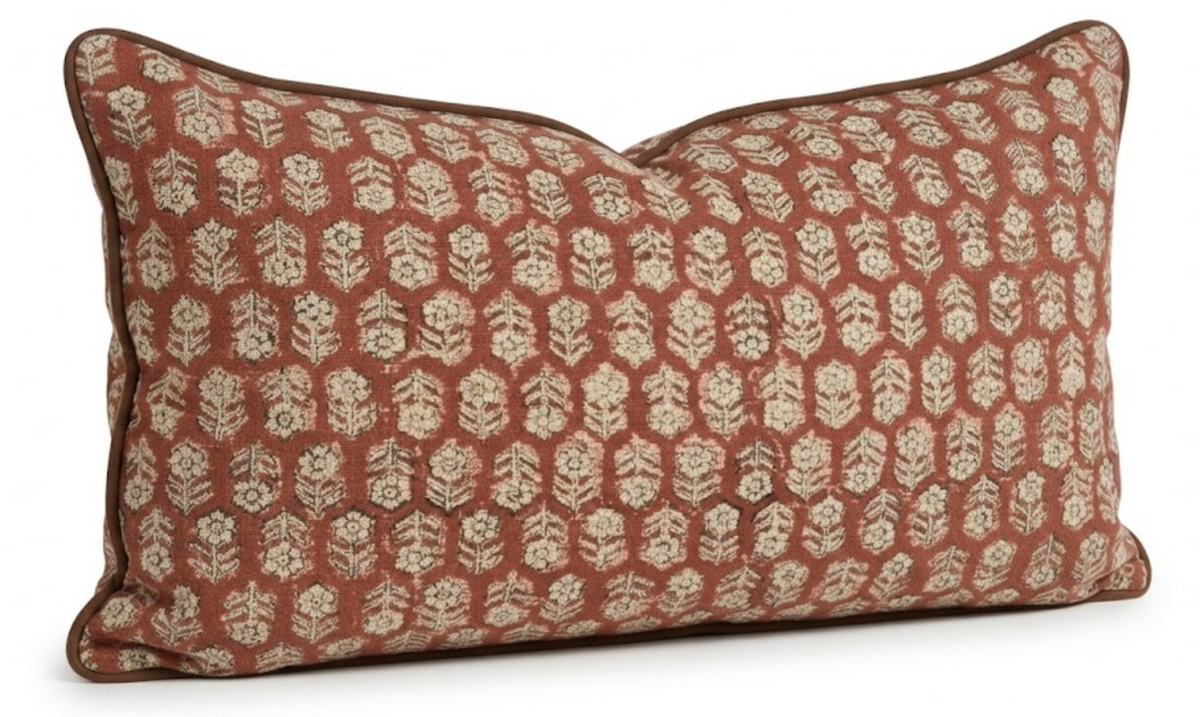 Tulsi Floral Pillow Cover in Saffron styled on a sofa
