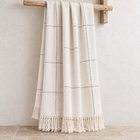 Kiara natural handwoven cotton throw with black stitching