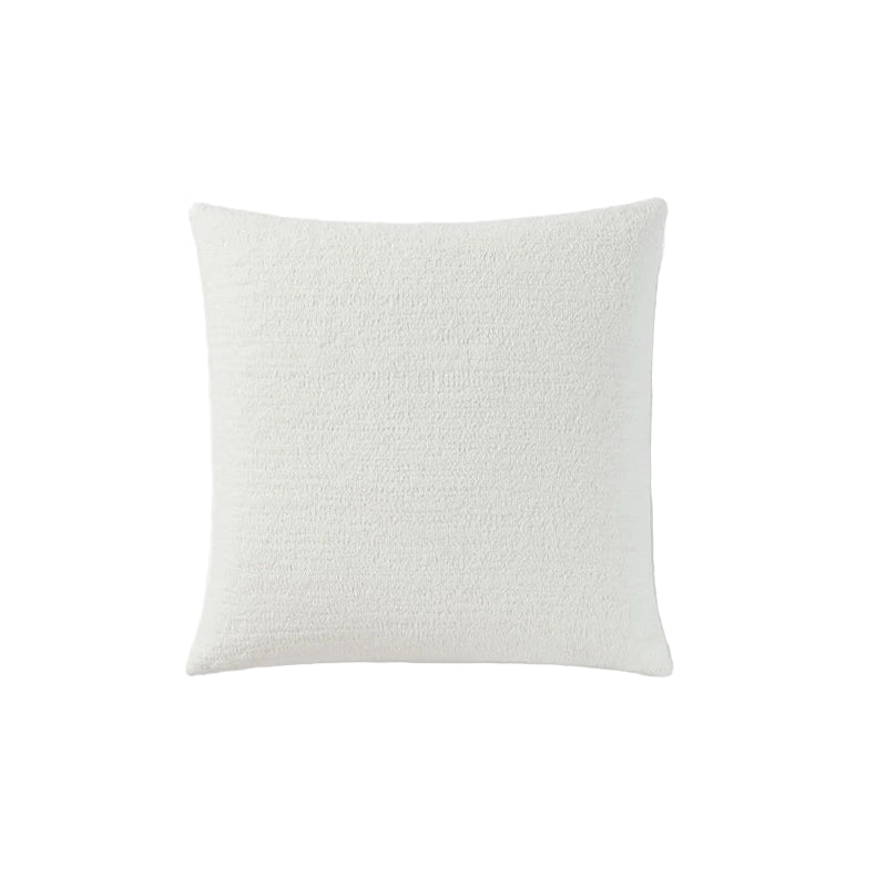 Snug Euro Sham styled on bed with layered pillows